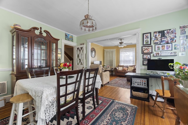 103 Eaton St, Bridgeport, CT 06604 - dining area with wood finished floors, ornamental molding, and a ceiling fan