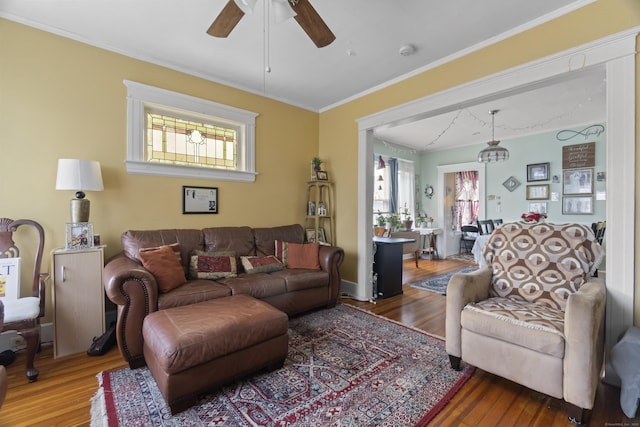 103 Eaton St, Bridgeport, CT 06604 - living area with wood finished floors, plenty of natural light, ceiling fan, and ornamental molding
