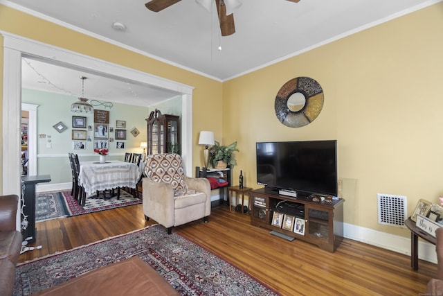 103 Eaton St, Bridgeport, CT 06604 - living area with wood finished floors, ceiling fan, crown molding, and a chandelier