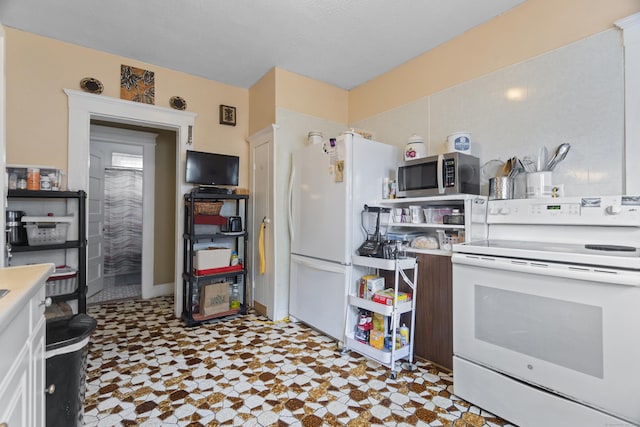 103 Eaton St, Bridgeport, CT 06604 - kitchen with white appliances and tile patterned floors