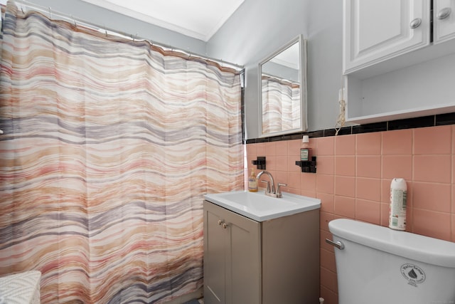 103 Eaton St, Bridgeport, CT 06604 - bathroom featuring vanity, tile walls, crown molding, a wainscoted wall, and a shower with curtain