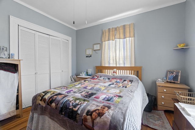 103 Eaton St, Bridgeport, CT 06604 - bedroom with wood finished floors, a closet, and crown molding