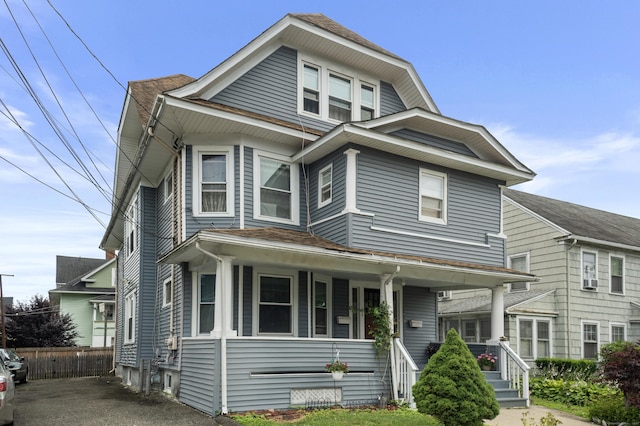 103 Eaton St, Bridgeport, CT 06604 - view of front of house with a porch and roof with shingles
