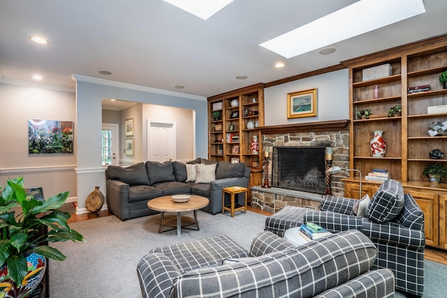 6 Salisbury Way, Farmington, CT 06032 - living area featuring crown molding, a skylight, a fireplace, and recessed lighting