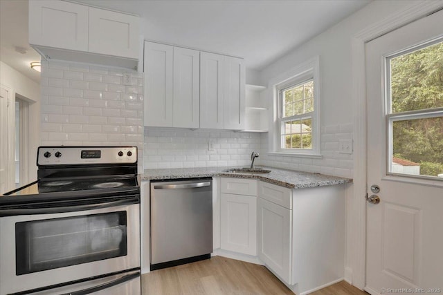 270 Hills St, East Hartford, CT 06118 - kitchen featuring stainless steel appliances, healthy amount of natural light, white cabinetry, and light wood-style flooring