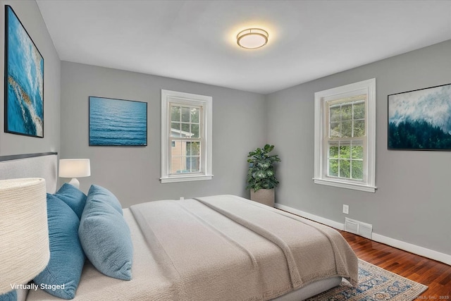 270 Hills St, East Hartford, CT 06118 - bedroom with multiple windows and wood finished floors