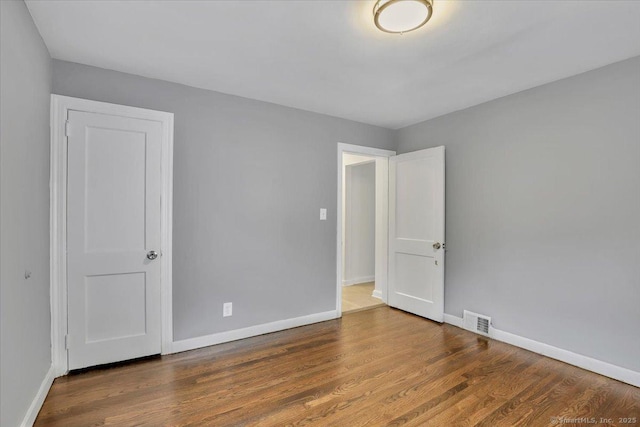 270 Hills St, East Hartford, CT 06118 - empty room featuring baseboards and wood finished floors