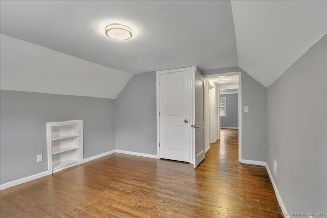 270 Hills St, East Hartford, CT 06118 - bonus room featuring built in shelves, wood finished floors, and vaulted ceiling