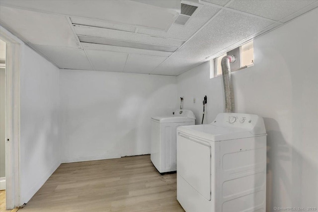 270 Hills St, East Hartford, CT 06118 - laundry area with washer and clothes dryer and light wood-style floors