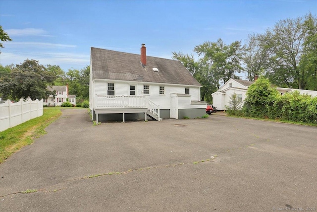 270 Hills St, East Hartford, CT 06118 - rear view of property with a chimney and stairs