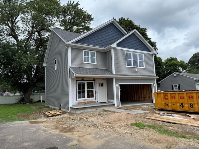 46 Wakeley St, Shelton, CT 06484 - view of front of home featuring an attached garage, driveway, and roof with shingles