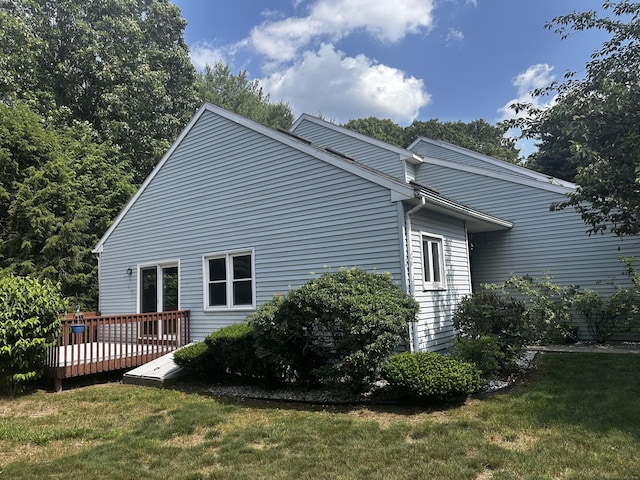 18 Daniel Dr Unit 18, East Windsor, CT 06088 - view of side of property with a wooden deck and a yard