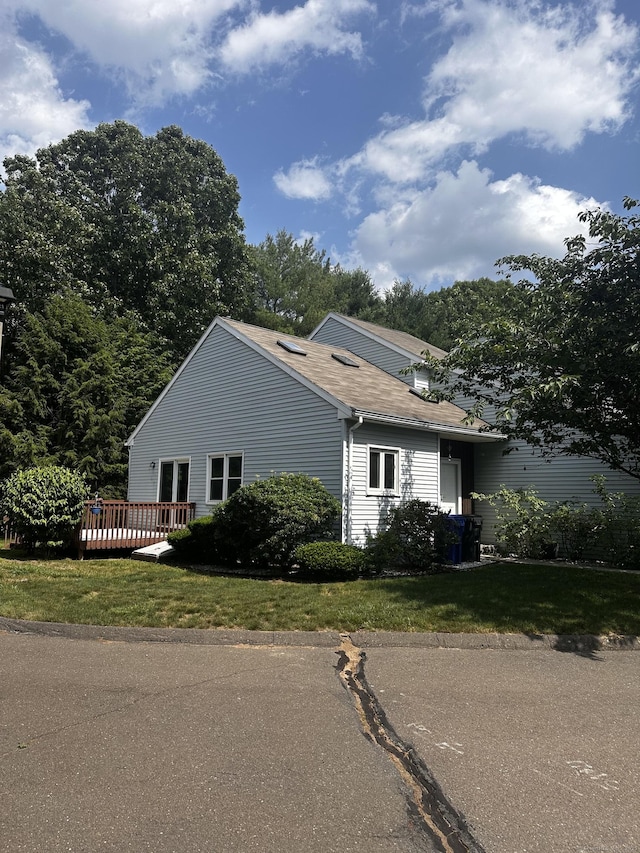 18 Daniel Dr Unit 18, East Windsor, CT 06088 - view of property exterior with a wooden deck and a yard