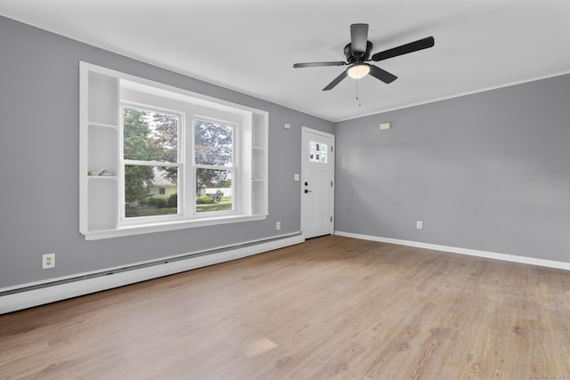 17 Norwood Rd, New Haven, CT 06513 - foyer entrance with a baseboard heating unit, ceiling fan, and light wood-style flooring
