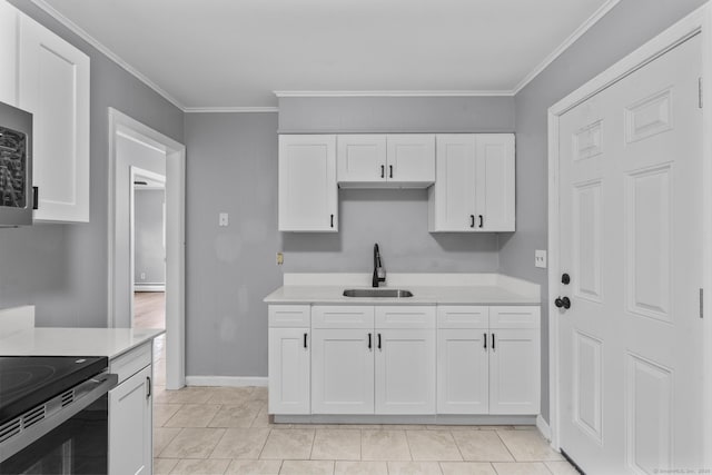 17 Norwood Rd, New Haven, CT 06513 - kitchen featuring stainless steel appliances, light countertops, white cabinetry, and ornamental molding