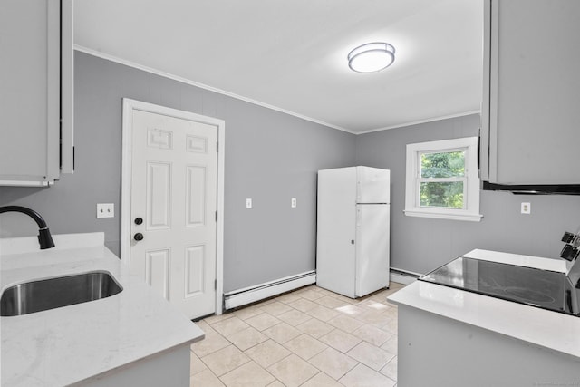 17 Norwood Rd, New Haven, CT 06513 - kitchen with crown molding, freestanding refrigerator, a baseboard radiator, light tile patterned floors, and electric range