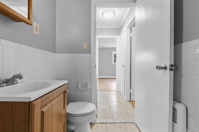 17 Norwood Rd, New Haven, CT 06513 - bathroom featuring tile walls, vanity, ornamental molding, tile patterned flooring, and a wainscoted wall