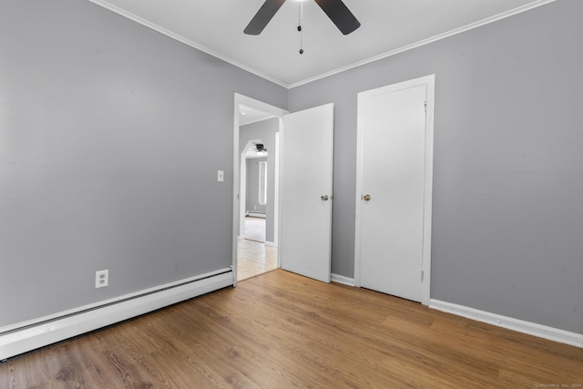 17 Norwood Rd, New Haven, CT 06513 - unfurnished bedroom with a baseboard heating unit, crown molding, wood finished floors, and ceiling fan