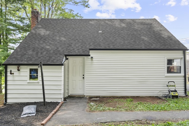 17 Norwood Rd, New Haven, CT 06513 - back of property with a shingled roof and a chimney
