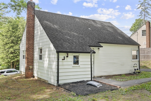 17 Norwood Rd, New Haven, CT 06513 - view of side of home with roof with shingles and a chimney