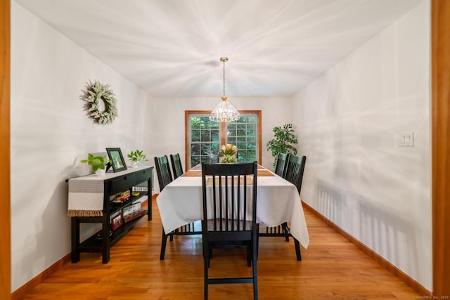 195 Crane Hollow Rd, Bethlehem, CT 06751 - dining room with a chandelier and light wood-style flooring