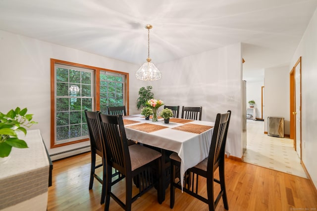 195 Crane Hollow Rd, Bethlehem, CT 06751 - dining space featuring a chandelier, a baseboard heating unit, and light wood-style floors