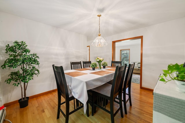 195 Crane Hollow Rd, Bethlehem, CT 06751 - dining area featuring a chandelier and light wood finished floors