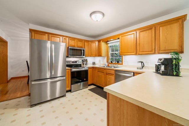 195 Crane Hollow Rd, Bethlehem, CT 06751 - kitchen featuring appliances with stainless steel finishes, light countertops, light floors, and brown cabinets
