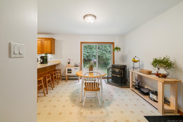 195 Crane Hollow Rd, Bethlehem, CT 06751 - dining space with a wood stove and baseboard heating