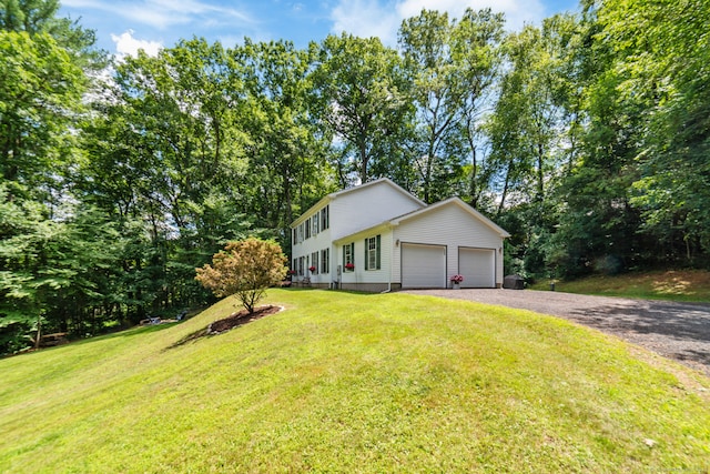195 Crane Hollow Rd, Bethlehem, CT 06751 - view of front of house with a garage, a front yard, gravel driveway, and view of scattered trees