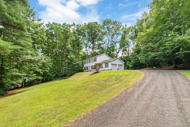 195 Crane Hollow Rd, Bethlehem, CT 06751 - view of front of house featuring driveway, a front yard, and an attached garage