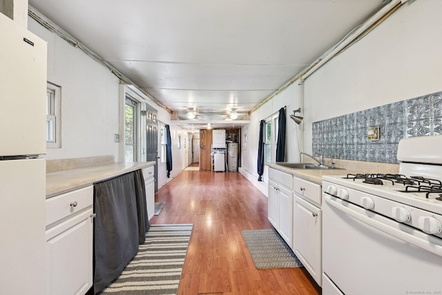 133 W Main St Trlr C6, Clinton, CT 06413 - kitchen featuring white appliances, white cabinetry, light countertops, and light wood-style floors