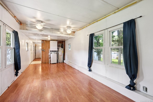 133 W Main St Trlr C6, Clinton, CT 06413 - unfurnished living room with water heater, light wood-type flooring, and a ceiling fan