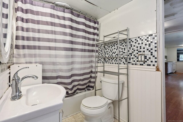 133 W Main St Trlr C6, Clinton, CT 06413 - bathroom featuring shower / bath combination with curtain and wainscoting