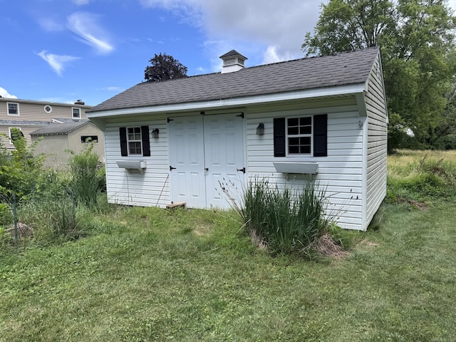 190 Elm St, Windsor Locks, CT 06096 - rear view of house with a storage shed, a lawn, and roof with shingles