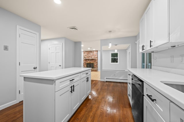 7 Woodmont Rd, Avon, CT 06001 - kitchen featuring stainless steel dishwasher, a baseboard radiator, dark wood-type flooring, and light countertops