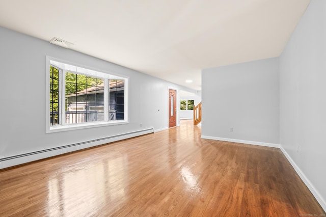 7 Woodmont Rd, Avon, CT 06001 - unfurnished living room with baseboard heating and wood finished floors