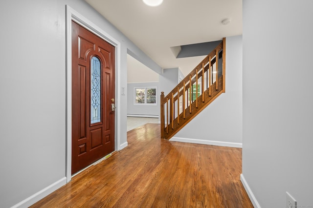 7 Woodmont Rd, Avon, CT 06001 - foyer with wood finished floors, stairway, and baseboard heating
