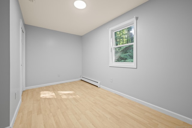 7 Woodmont Rd, Avon, CT 06001 - unfurnished room featuring a baseboard heating unit and wood finished floors