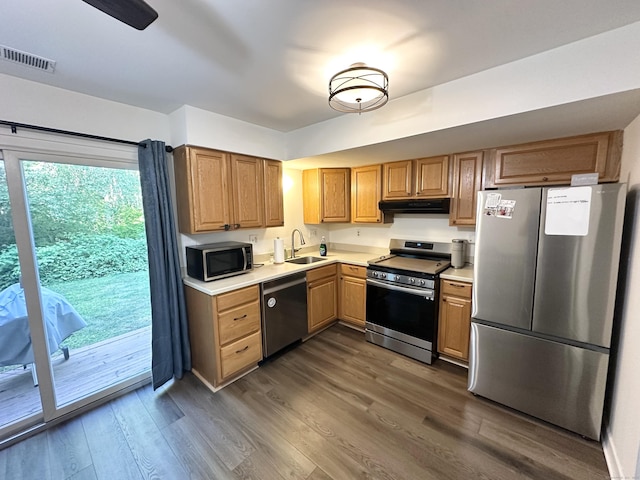 63 Coleman St Apt 14, East Haven, CT 06512 - kitchen featuring appliances with stainless steel finishes, ventilation hood, dark wood finished floors, and light countertops