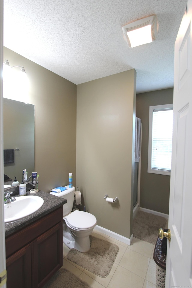 3 Holly Ln Unit 3, Farmington, CT 06085 - bathroom with vanity, a shower with door, tile patterned floors, and a textured ceiling