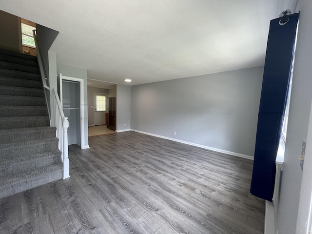 56 Elm St Apt 36, Enfield, CT 06082 - unfurnished living room with wood finished floors and stairs