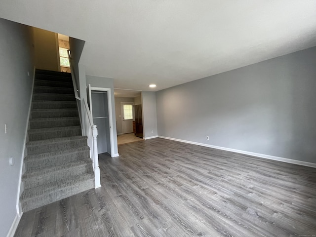 56 Elm St Apt 36, Enfield, CT 06082 - unfurnished living room featuring stairway, wood finished floors, and recessed lighting