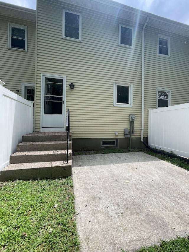 56 Elm St Apt 36, Enfield, CT 06082 - rear view of property with entry steps and a patio