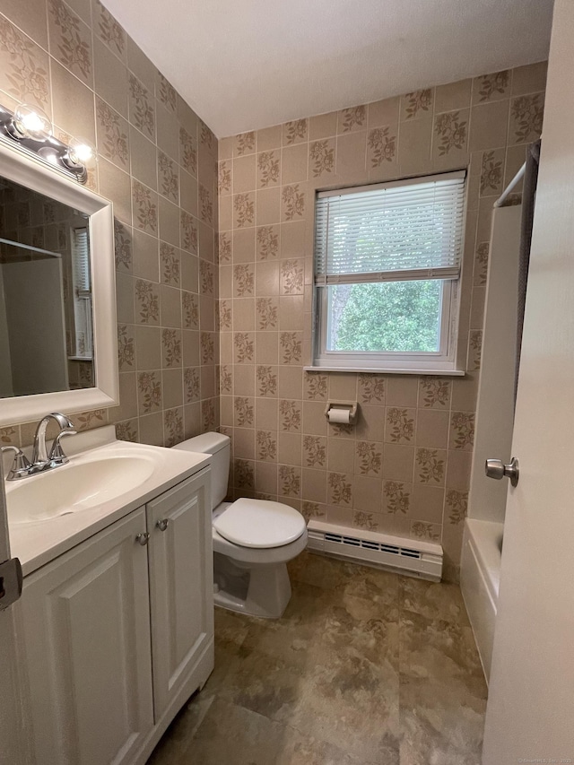56 Elm St Apt 36, Enfield, CT 06082 - full bathroom with baseboard heating, vanity, and bathtub / shower combination