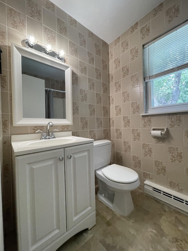 56 Elm St Apt 36, Enfield, CT 06082 - bathroom featuring a baseboard radiator, vanity, tile walls, and curtained shower