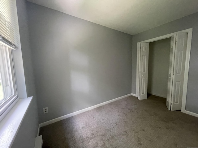 56 Elm St Apt 36, Enfield, CT 06082 - unfurnished bedroom featuring carpet floors and a closet