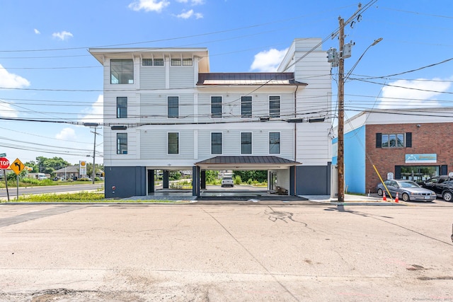 32 Broadway Ave, Stonington, CT 06355 - view of property featuring covered and uncovered parking