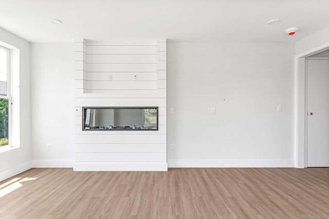 32 Broadway Ave, Stonington, CT 06355 - unfurnished living room featuring light wood-style flooring and healthy amount of natural light