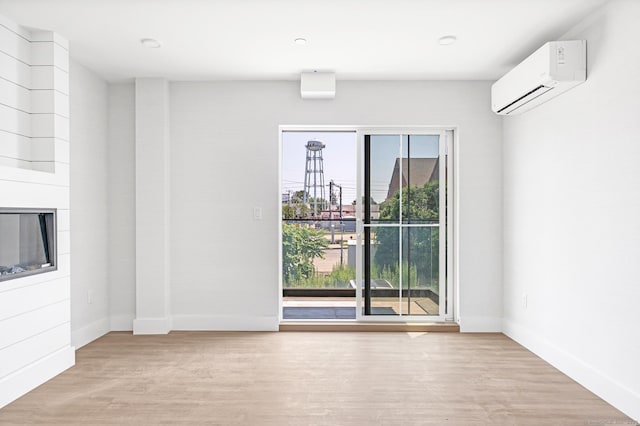 32 Broadway Ave, Stonington, CT 06355 - unfurnished room featuring a wall mounted AC and wood finished floors